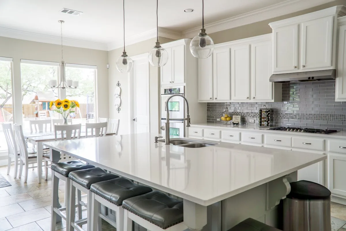 Renovated kitchen with new white cabinets and modern finishes - Belleville home value