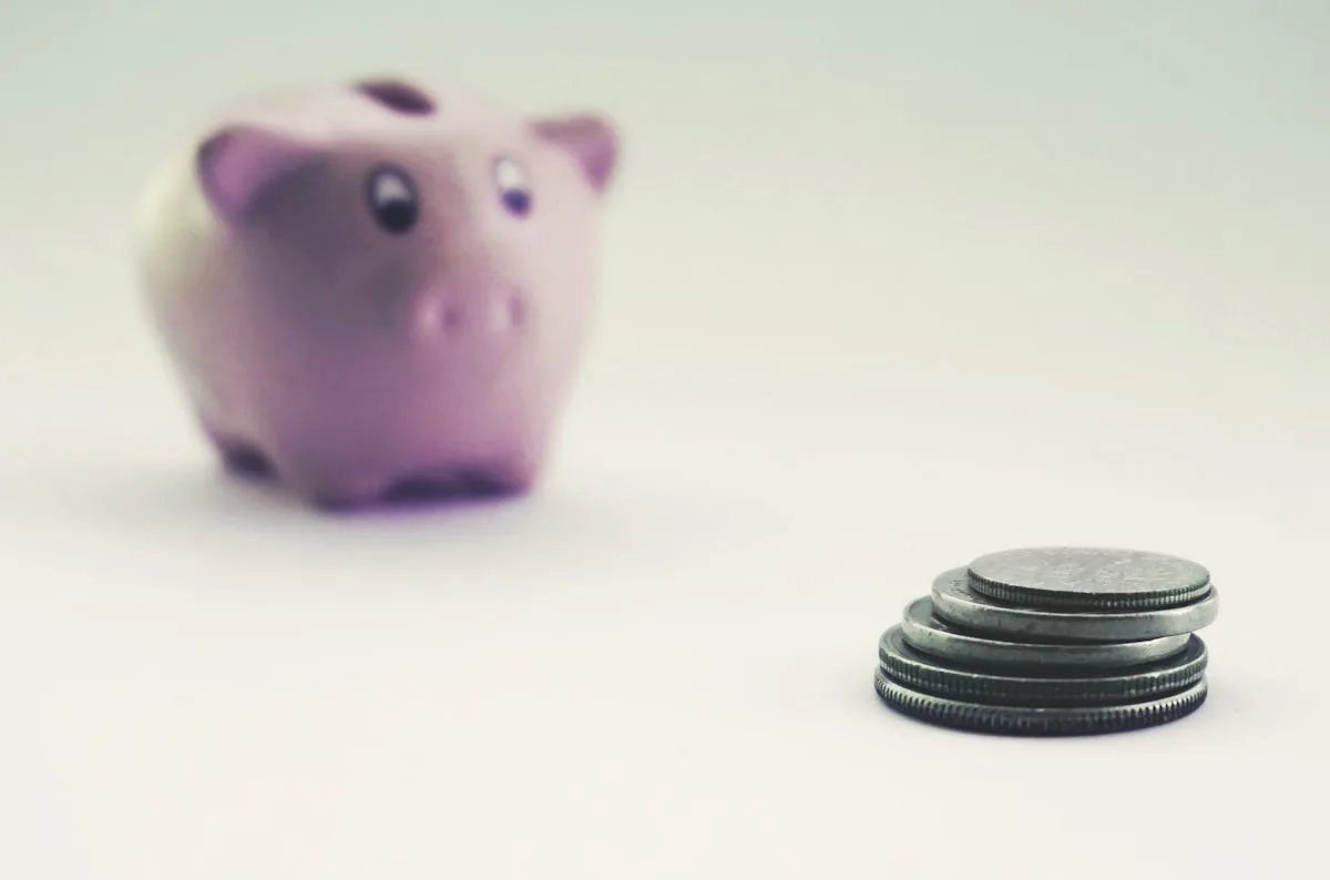 Piggy bank with coins representing RRSP TFSA government-sponsored savings and investment plans Canada