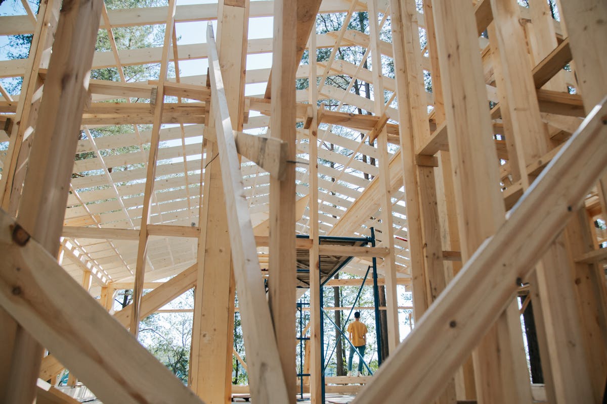 Wooden house frame under construction - Habitat for Humanity affordable homes Belleville Habitat Village
