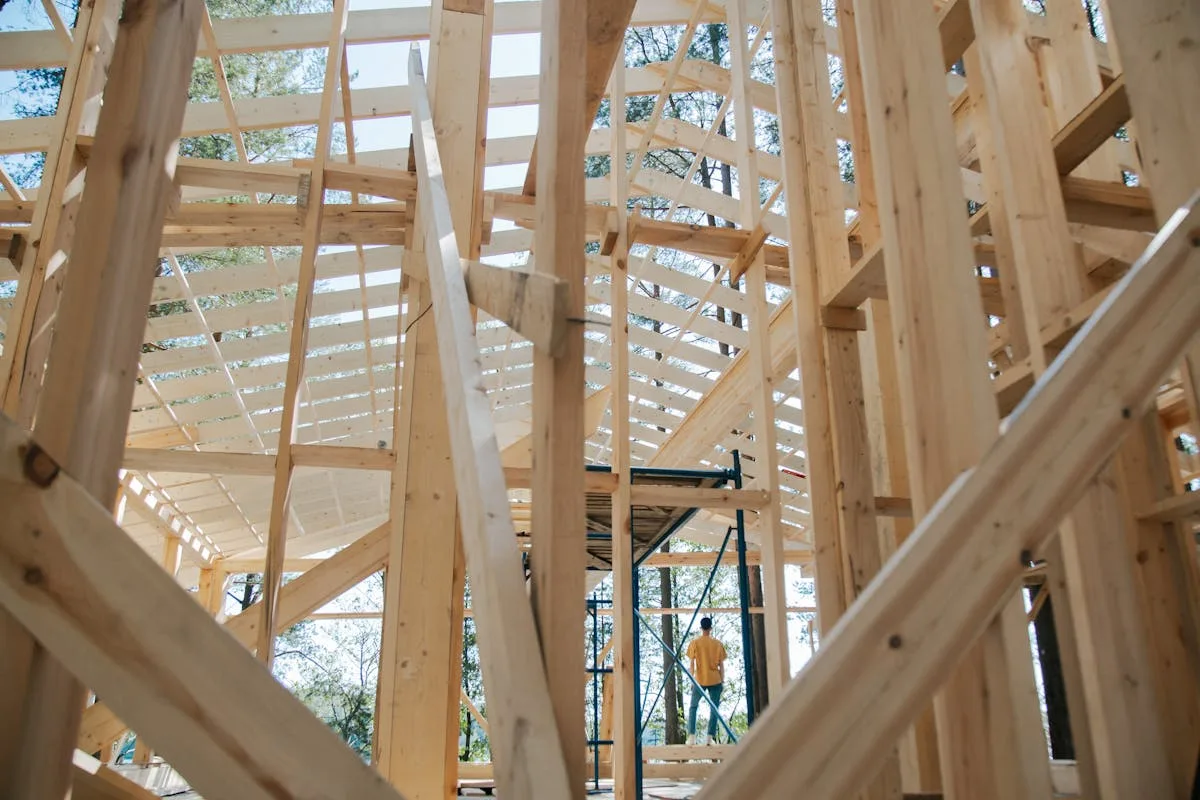 Wooden house frame under construction - Habitat for Humanity affordable homes Belleville Habitat Village
