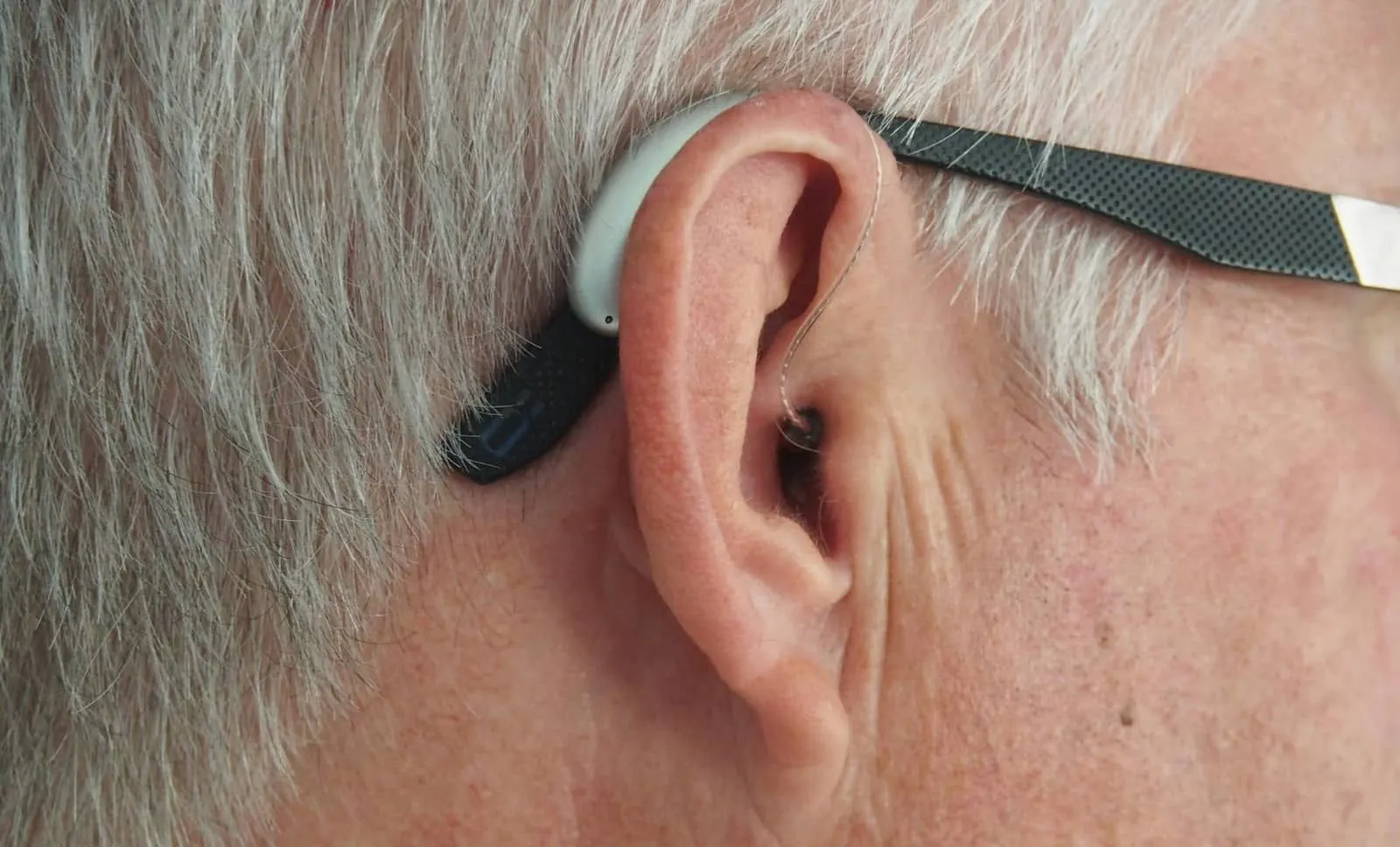 Close-up of an ear illustrating gradual hearing loss - audiology and hearing health for seniors in Belleville, Ontario